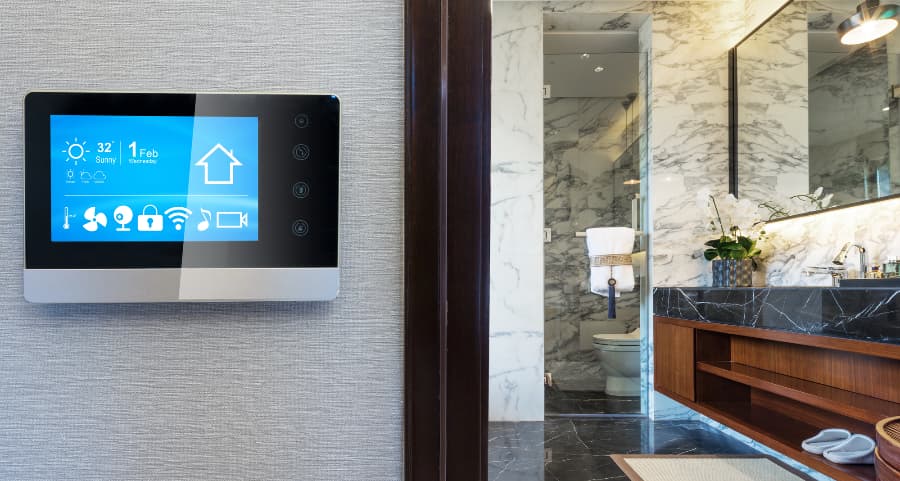 Smart home control panel on wall next to bathroom